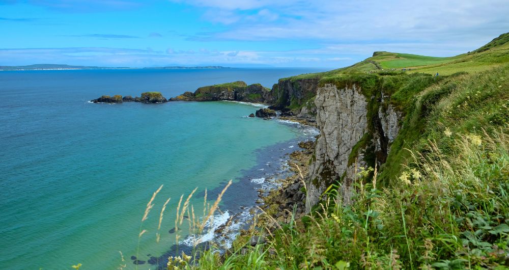 Coastal cliffs and turquoise waters of Northern Ireland